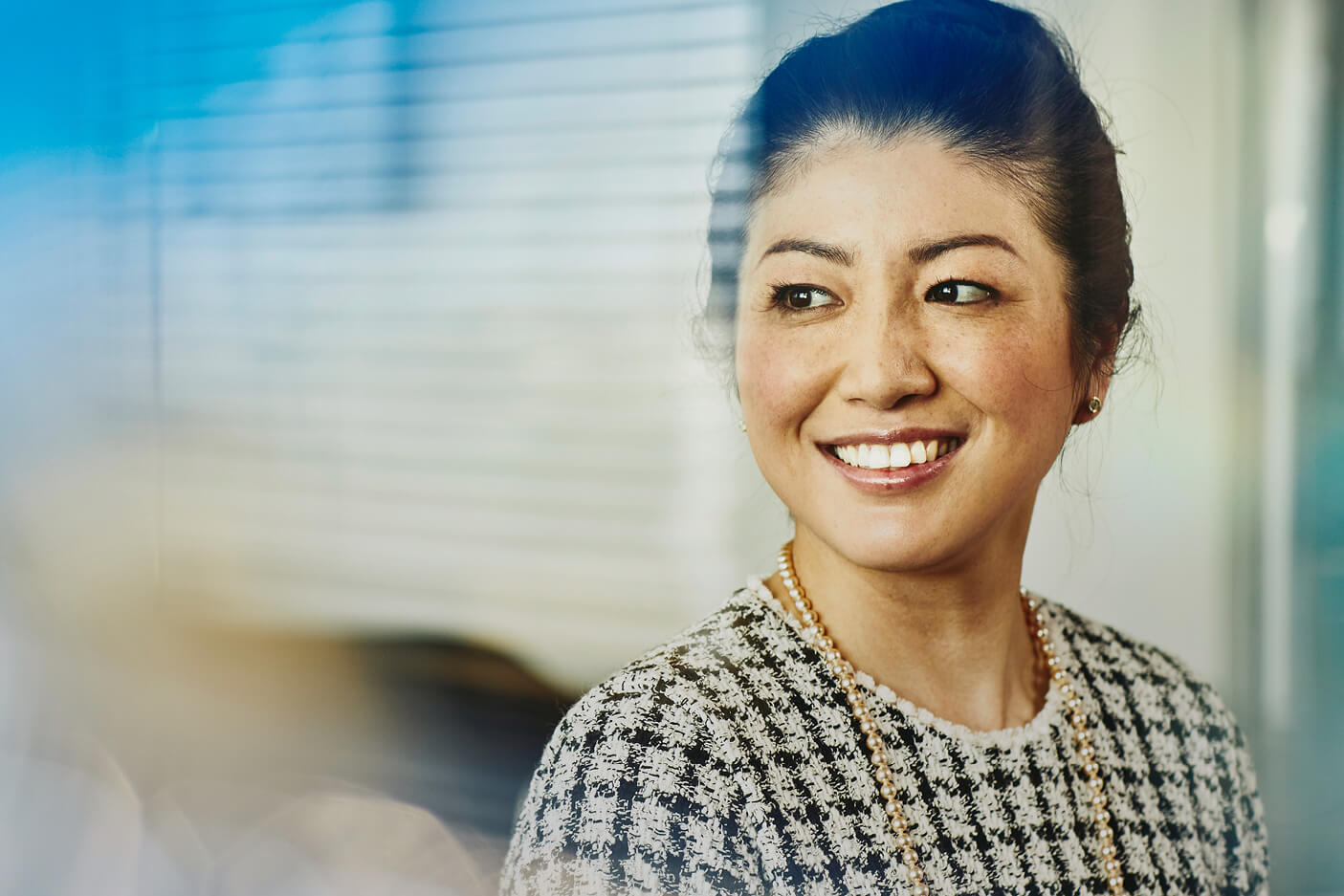 Close up - Smiling woman looking away