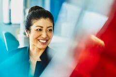 Woman smiling and looking away