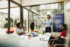 Man doing a presentation to his colleague