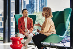 two colleagues talking in the office