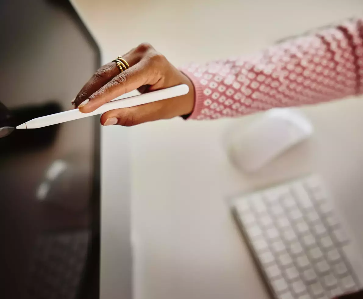 Close up of touch pen touching a desktop screen